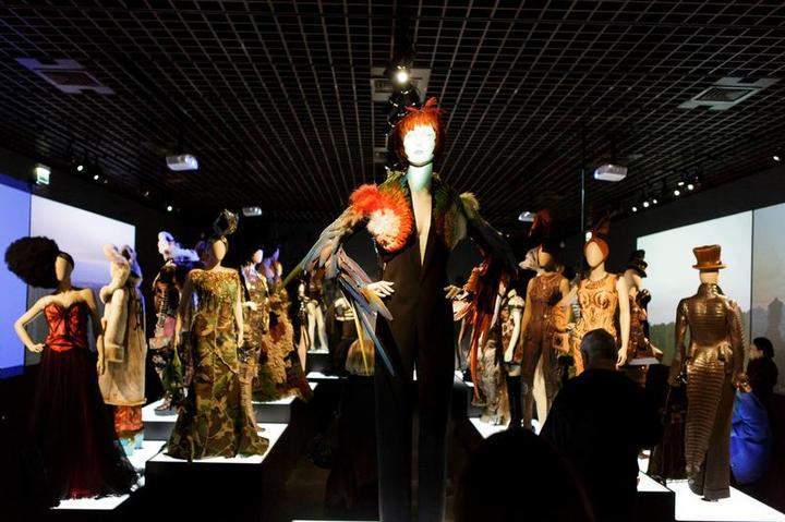 Mannequins are seen during an exhibition by French fashion designer Jean-Paul Gaultier at the Grand Palais in Paris on April 1, 2015.