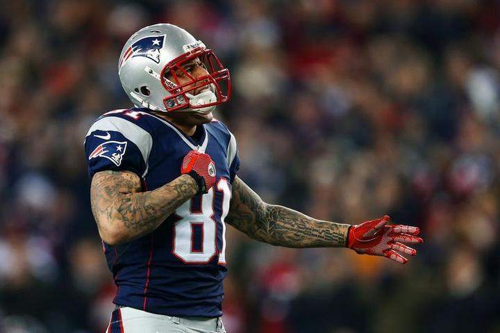 Aaron Hernandez #81 of the New England Patriots reacts after a catch in the third quarter against the Houston Texans during the 2013 AFC Divisional Playoffs game at Gillette Stadium on January 13, 2013 in Foxboro, Massachusetts.