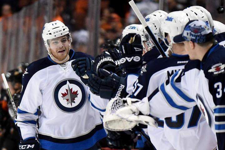 Adam Lowry celebrates after scoring a goal against the Anaheim Ducks in last year's playoffs.
