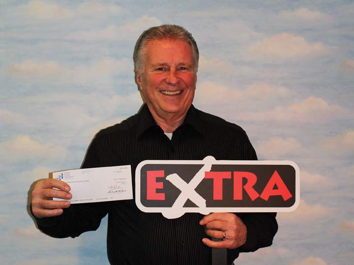 Allen Olson wins $100,000 dollars with lottery ticket purchased in Saskatoon.