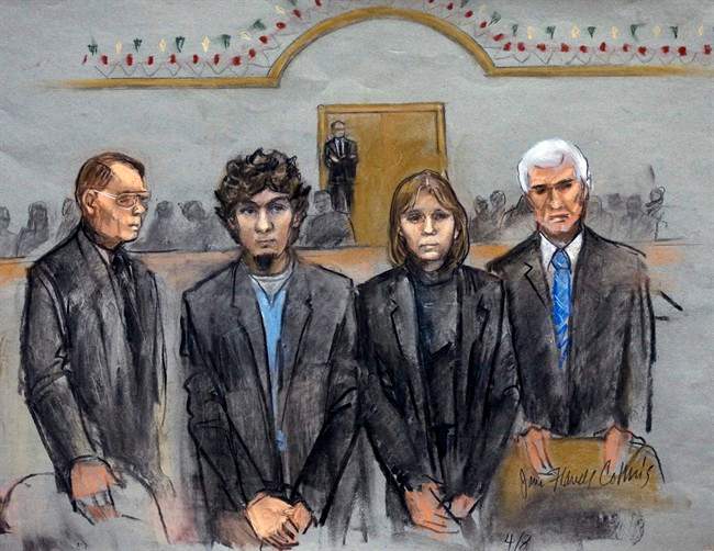 In this courtroom sketch, Dzhokhar Tsarnaev, second from left, is depicted standing with his defense attorneys as the jury presents its verdict in his federal death penalty trial Wednesday, April 8, 2015, in Boston. Tsarnaev was convicted on multiple charges in the 2013 Boston Marathon bombing.