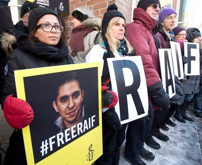 Ensaf Haidar, left, wife of blogger Raif Badawi, takes part in a rally for his freedom, January 13, 2015 in Montreal.