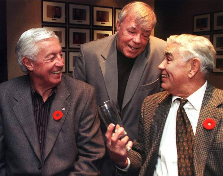 Jean Beliveau chats with former teammates Jean-Guy Talbot (centre) and Dollard St.Laurent in Montreal, Thursday, Nov.11, 1999.