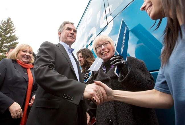 Alberta Premier Jim Prentice shakes the hands of supporters in Edmonton, on Tuesday April 7, 2015.