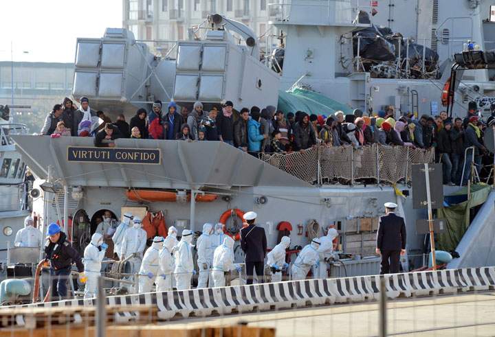 A boat transporting migrants arrives in the port of Messina after a rescue operation at sea on April 18, 2015 in Sicily.