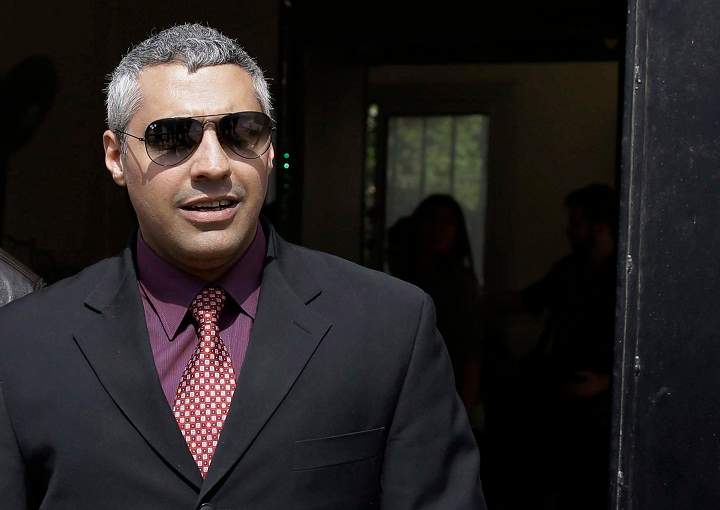 Al Jazeera English journalist Canadian Mohamed Fahmy leaves court after a hearing in the retrial near Tora prison in Cairo, Egypt, Sunday, March 8, 2015.