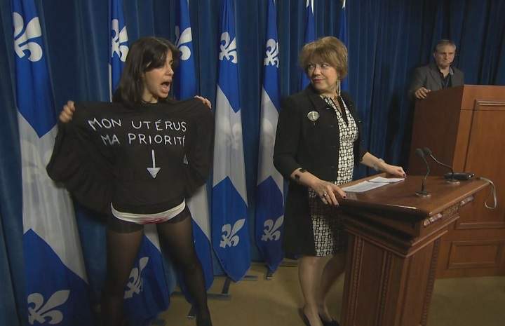 Concerned about access to abortion, a topless activist staged a dramatic interruption at a news conference held by Quebec’s culture minister on April 30, 2015.