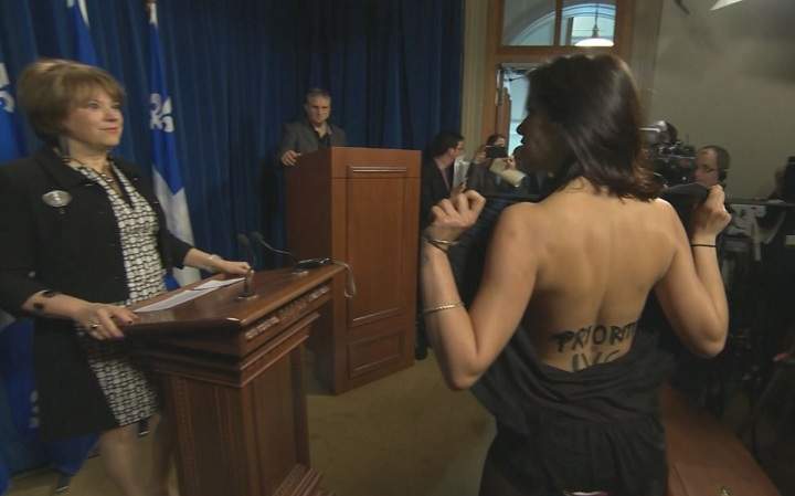 Concerned about access to abortion, a topless activist staged a dramatic interruption at a news conference held by Quebec's culture minister on April 30, 2015.