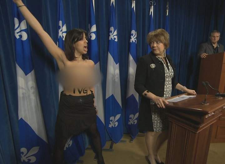 Concerned about access to abortion, a topless activist staged a dramatic interruption at a news conference held by Quebec's culture minister on April 30, 2015.