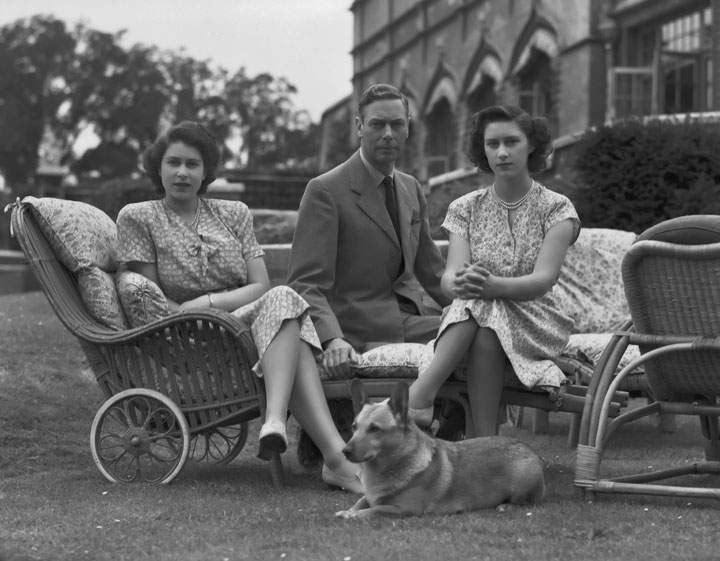 King George VI (1895-1952) with his daughters Princess Elizabeth and Princess Margaret (1930 - 2002) in the grounds of Windsor Castle in Windsor, England on July 08, 1946.
