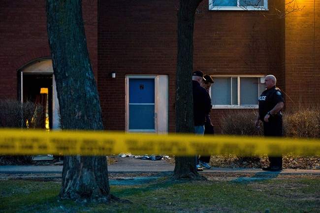 Police officers at the scene of a multiple shooting near Driftwood and Finch Avenues in Toronto Thursday, April 16, 2015.