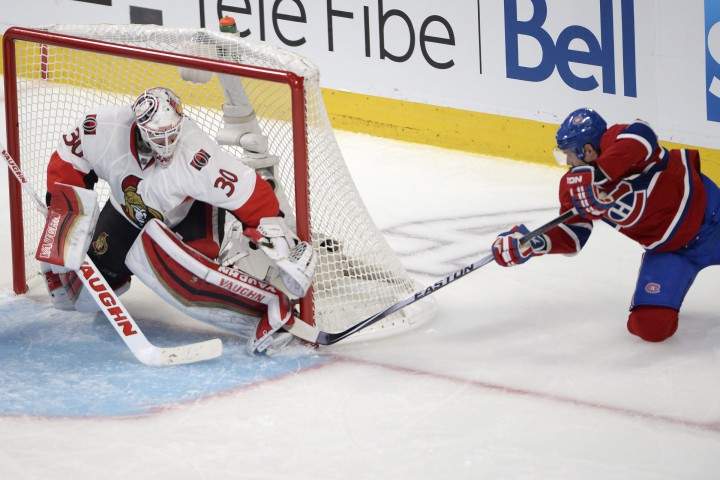 Montreal Canadiens' Torrey Mitchell (17) scores on Ottawa Senators goalie Andrew Hammond during second period NHL playoff action in Montreal, Wednesday, April 15, 2015.