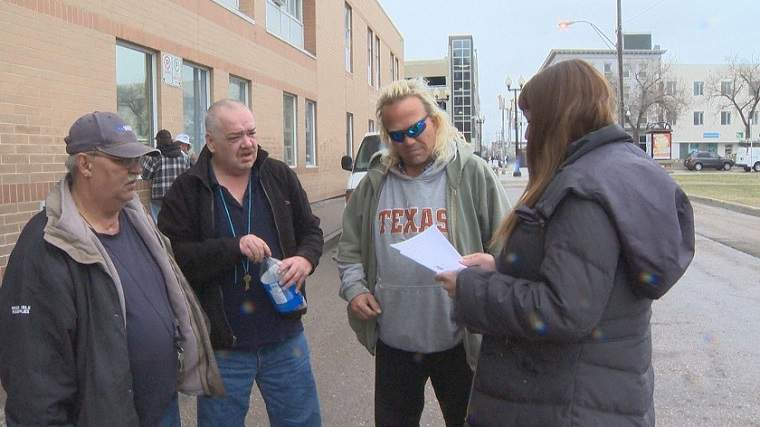 Christine Beck hands out the latest news story on two weekend murders that has Winnipeg\’s most vulnerable on edge