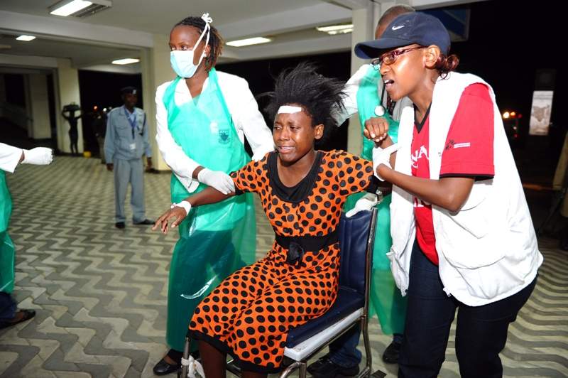 Paramedics attend to an injured Kenyan student as she is wheeled into Kenyatta National Hospital in Nairobi on April 2, 2015, following an attack at Garissa University College.