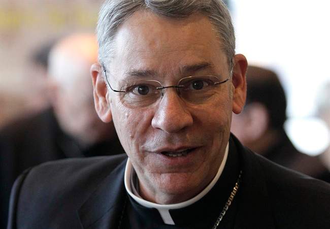 In this Nov. 14, 2011 file photo, Bishop Robert Finn, of Kansas City, Mo., leaves a meeting at the United States Conference of Catholic Bishops' annual fall assembly in Baltimore.