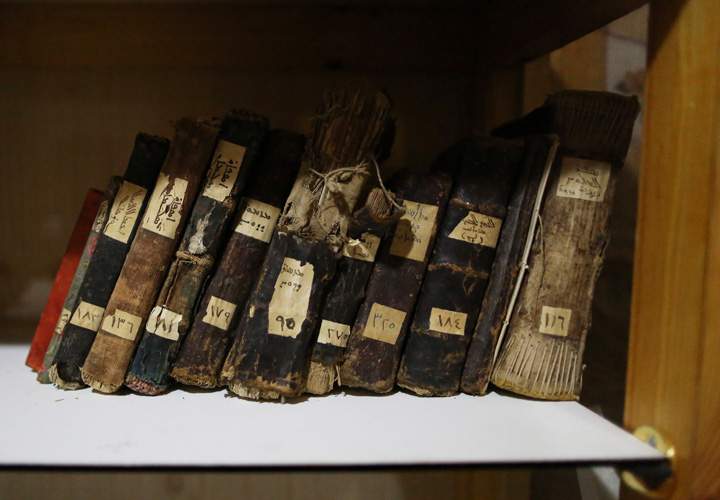Ancient manuscripts, some of them over a thousand years old, are being held in a bookcase in a location in the city of Dohuk, northern Iraq.