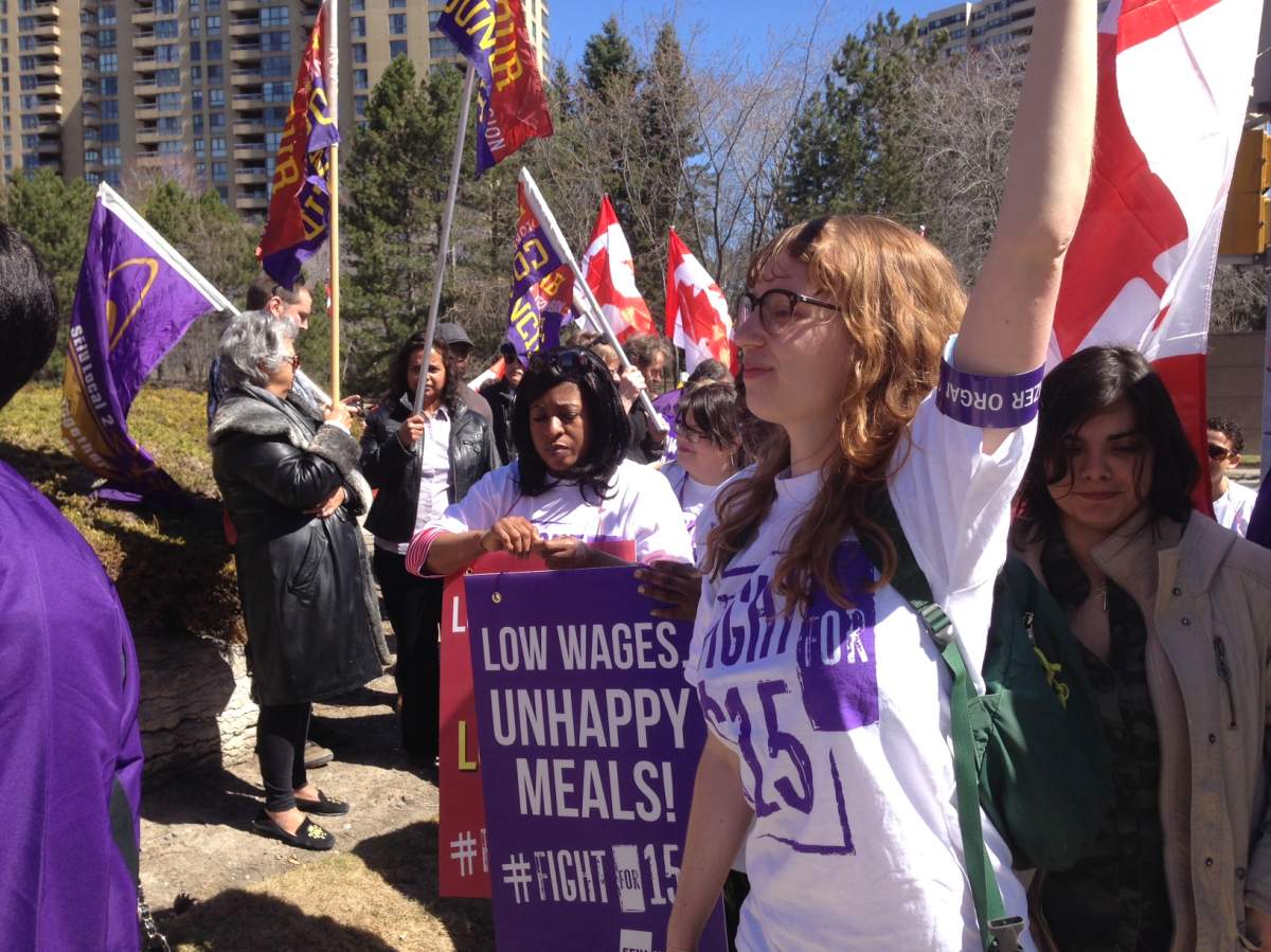 Demonstrators take part in a rally outside of the McDonald's headquarters in Toronto.