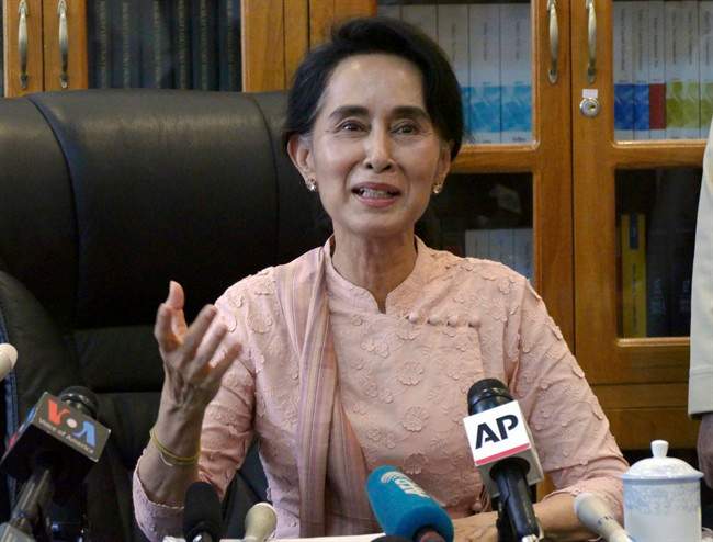 Myanmar opposition leader Aung San Suu Kyi speaks to journalists during a press conference at a parliament building Thursday, April 9, 2015 in Naypyitaw, Myanmar. 