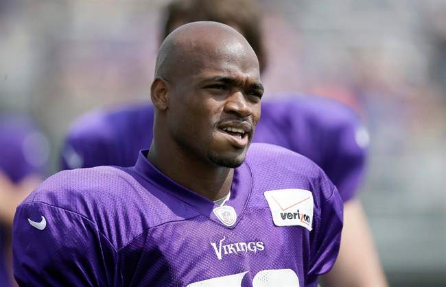 This July 31, 2014 file photo shows Minnesota Vikings running back Adrian Peterson during NFL football training camp in Mankato, Minn. 