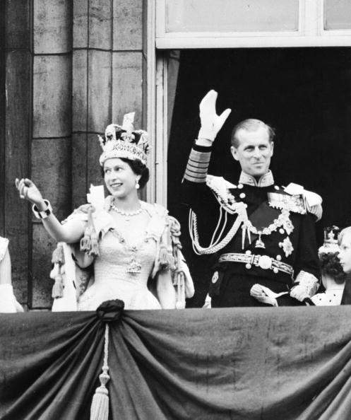 Britain’s Queen Elizabeth II accompanied by Prince Philip waves to the crowd, 02 June 1953, after being crowned solemnly at Westminter Abbey in London.