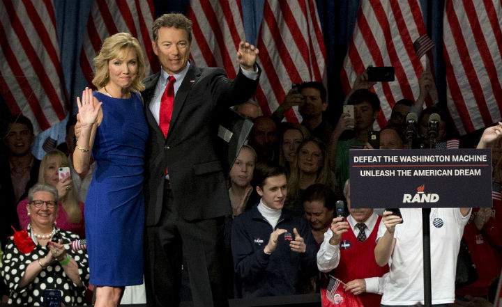 Sen. Rand Paul, R-Ky., joined by his wife Kelley Ashby, arrives to announce the start of his presidential campaign, Tuesday, April 7, at the Galt House Hotel in Louisville, Ky.