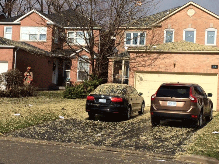 Debris is seen scattered through a residential street near an explosion in Scarborough.