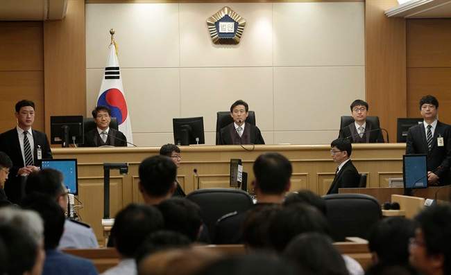 Judges sit to preside over verdicts for the sunken South Korean ferry Sewol's crew members who are charged with negligence and abandonment of passengers in the disaster at Gwangju High Court in Gwangju, South Korea, Tuesday, April 28, 2015.