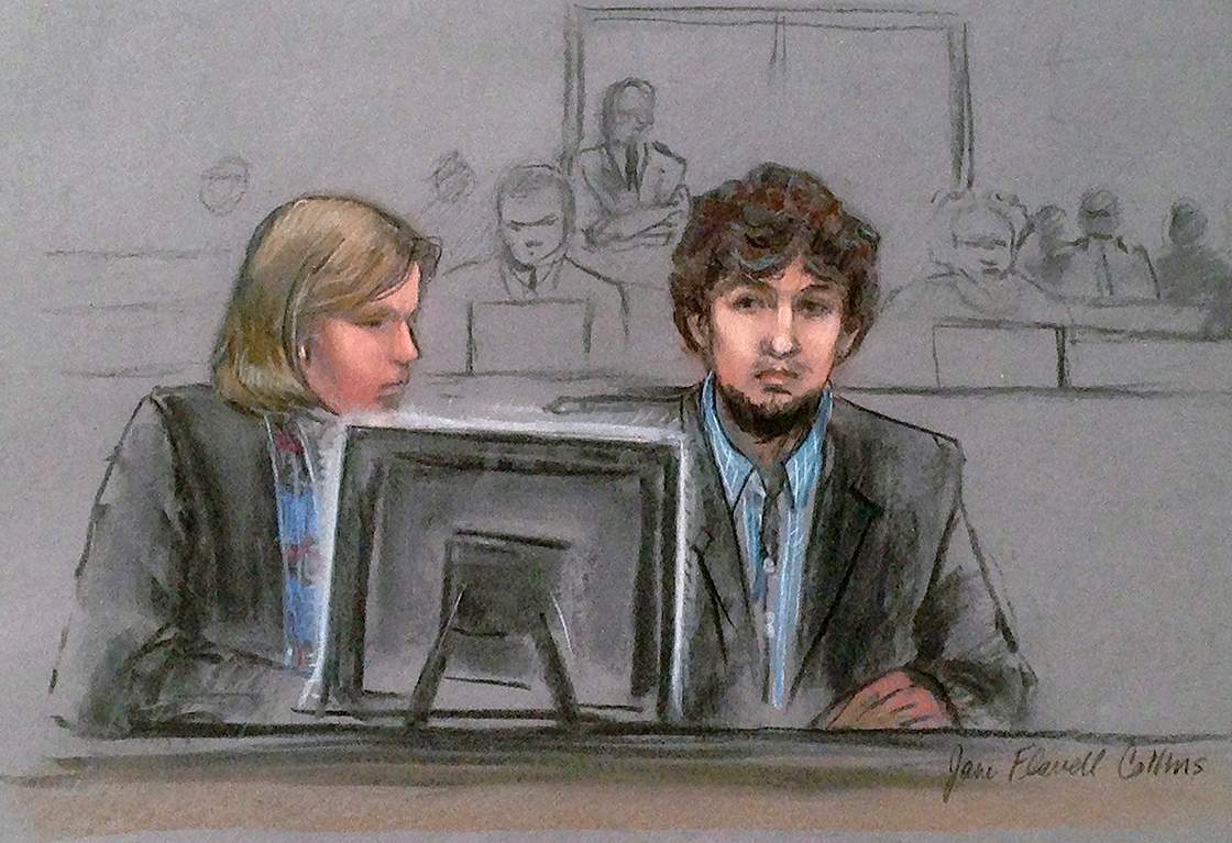 In this courtroom sketch, Dzhokhar Tsarnaev, right, and defense attorney Judy Clarke are depicted watching evidence displayed on a monitor during his federal death penalty trial.
