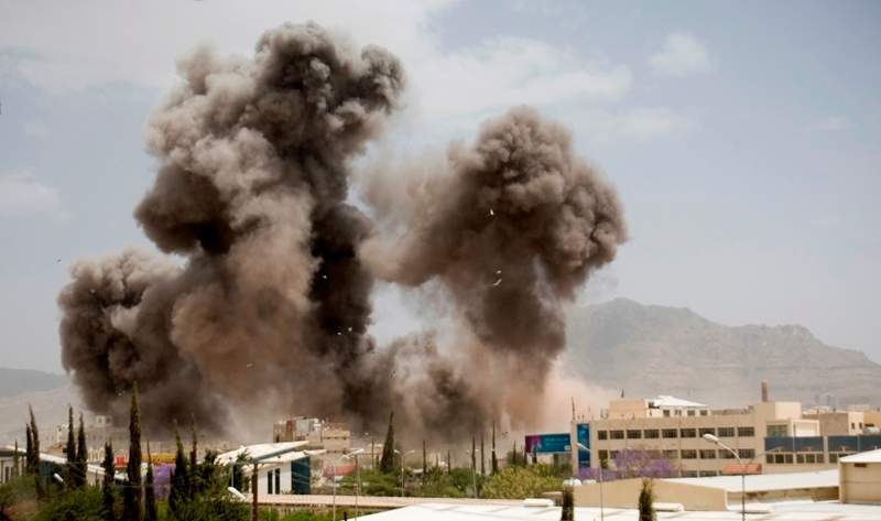 Smoke billows from a Saudi-led airstrike on Sanaa, Yemen, Wednesday, April 8, 2015. A state-run broadcaster in Iran is reporting that the Islamic Republic has sent a navy destroyer and another vessel to waters near Yemen amid a Saudi-led airstrike campaign. 