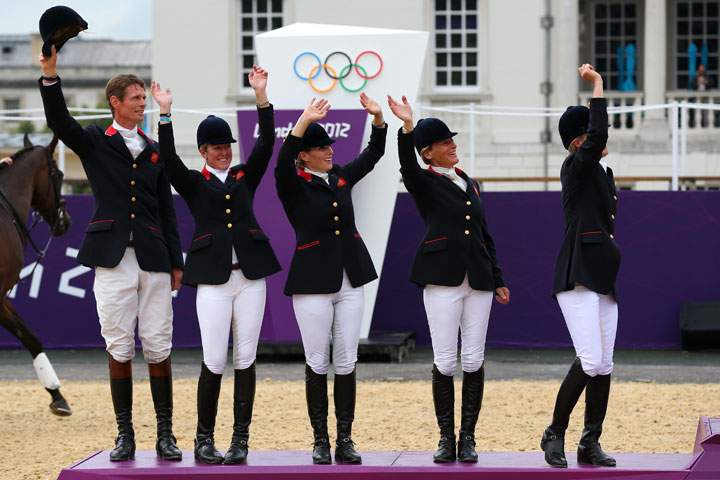 The Great Britain team celebrate on the podium after winning the Silver medal in the Eventing Team Jumping Final Equestrian event on Day 4 of the London 2012 Olympic Games at Greenwich Park on July 31, 2012 in London, England.