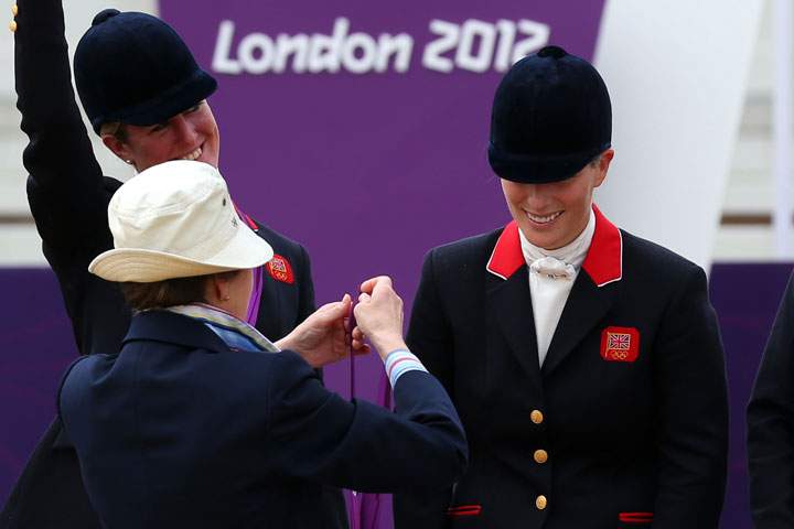 Zara Phillips is presented a silver medal by her mother, Princess Anne, Princess Royal after the Eventing Team Jumping Final Equestrian event on Day 4 of the London 2012 Olympic Games at Greenwich Park on July 31, 2012 in London, England.