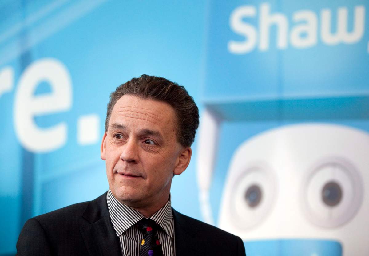 Brad Shaw, CEO of Shaw Communications, talks with shareholders before addressing the company's annual meeting in Calgary, Wednesday, Jan. 9, 2013.