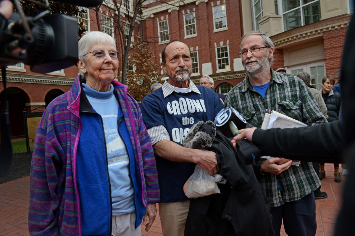 ( L-R ) Sister Megan Rice, Michael Walli and Gregory Boertje-Obed are interviewed by local media after appearing in federal court in Knoxville, TN on February 7, 2013.   