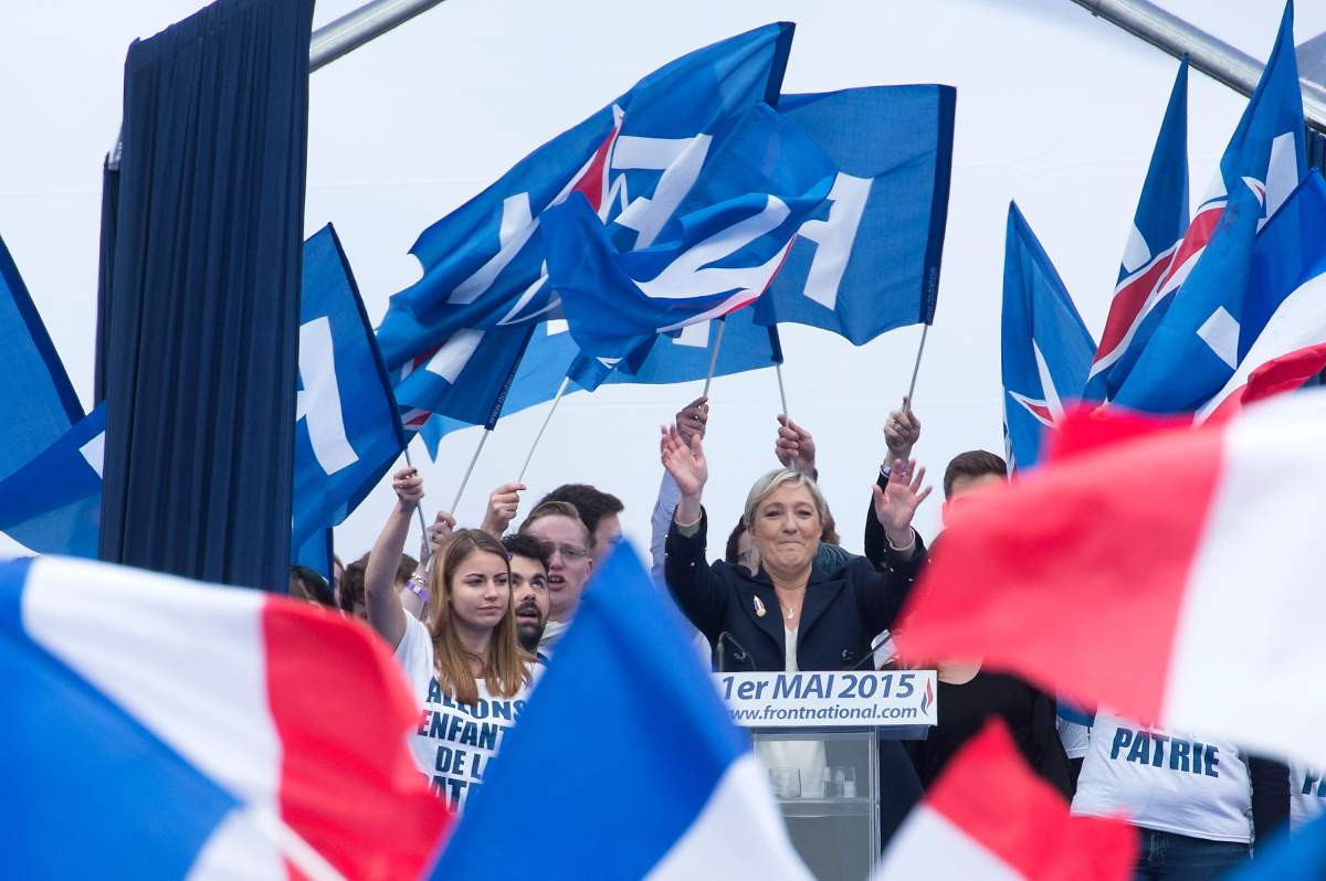France's far-right Front National (FN) party president Marine Le Pen delivers a speech on stage during the National Front annual rally honoring Joan of Arc on Place de l'Opera, on May 1, 2015 in Paris, France. 