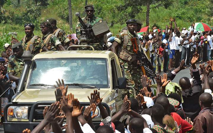 Soldiers lead the convoy of Burundi's President Pierre Nkurunziza's party, CNDD-FDD (National Council for the Defense of Democracy, Forces for the Defense of Democracy), during a rally outside Bujumbura on May 23, 2015.