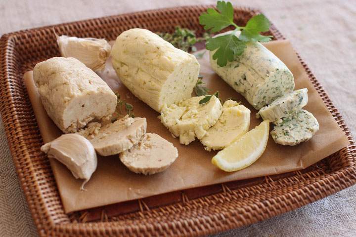 This April 13, 2015 photo shows herb compound from left, steak, citrus and herb butter in Concord, N.H.