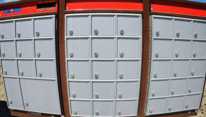 A distorted view of a Canada Post super mailbox in a new suburban development, Calgary, Alta., August 20, 2013. THE CANADIAN PRESS IMAGES/Bayne Stanley.