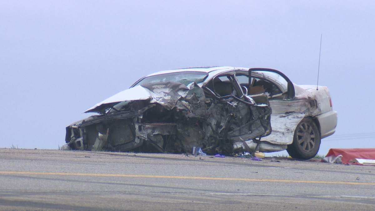 One woman is dead in a crash between a car and a semi on Highway 39.