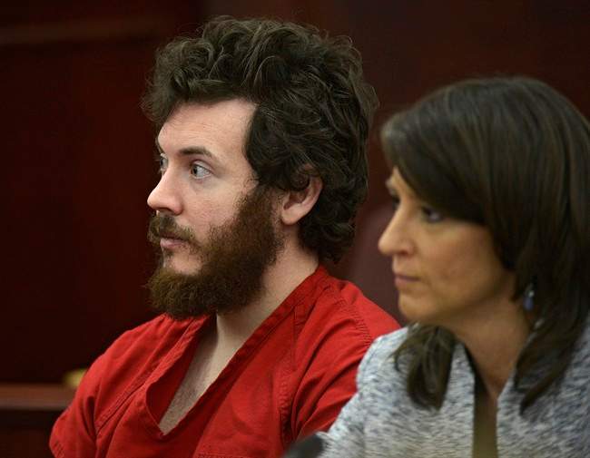 In this March 12, 2013, file photo, James Holmes, left, and defense attorney Tamara Brady appear in district court in Centennial, Colo., for his arraignment.