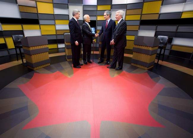 Prime Minister Stephen Harper, left to right, NDP Leader Jack Layton, Liberal Leader Michael Ignatieff and Bloc Quebecois Leader Gilles Duceppe exchange handshakes as they arrive to the English language federal election debate in Ottawa Ont., on Tuesday, April 12, 2011. 