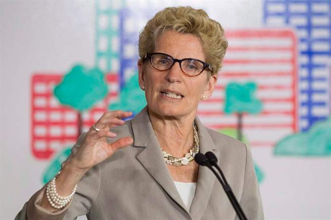 Ontario Premier Katholeen Wynne is shown addressing the media in Toronto on Monday, April 13 2015. 