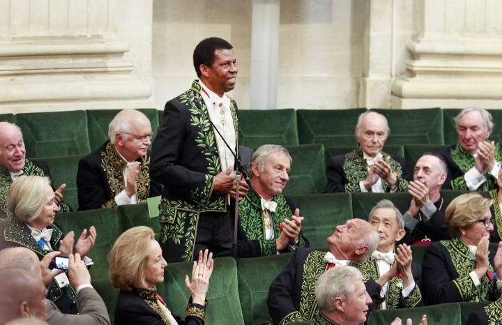 Haitian-born Canadian writer Dany Laferriere acknowledges applause after delivering his speech during his induction ceremony at the Academie Francaise in Paris, Thursday May 28, 2015.