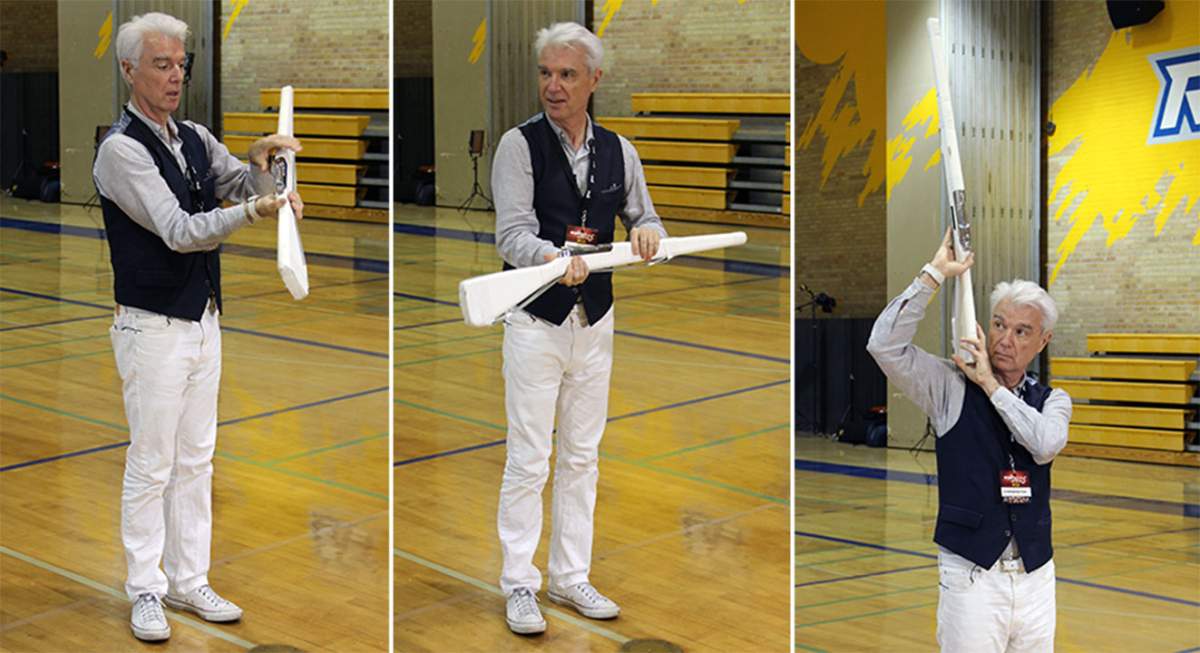 David Byrne tries out some colour guard moves during a media preview of ‘Contemporary Color’ in Toronto.