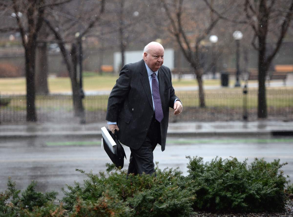Suspended Senator Mike Duffy arrives at the courthouse for his trial in Ottawa Monday, April 20, 2015. THE CANADIAN PRESS/Sean Kilpatrick.