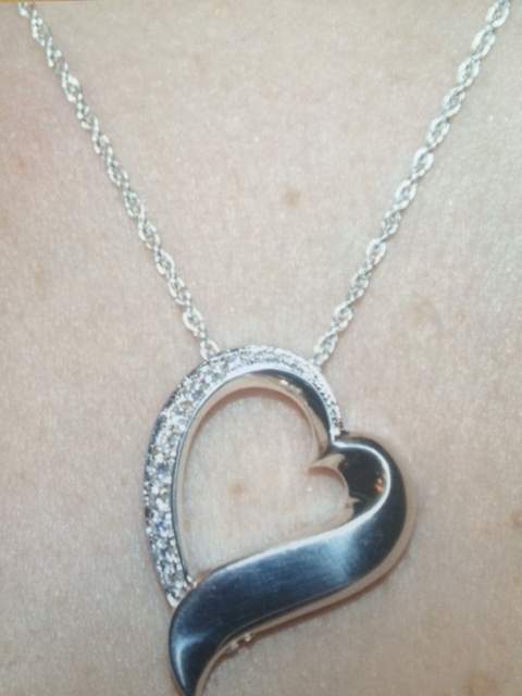 A stolen locket with son's ashes has been returned to family.