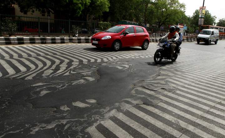 NEW DELHI, INDIA - MAY 24: A road melt near Safdarjung Hospital after the Temperature rise to 45 degree Celsius during a hot weather as Delhi/NCR experienced yet another scorching day, on May 24, 2015 in New Delhi, India. The national capital sizzling today as heat wave-like conditions prevailed across the city with mercury hovering above 45.3 degree Celsius, making life tough for the Delhiites. (Photo by Sanjeev Verma/Hindustan Times via Getty Images)