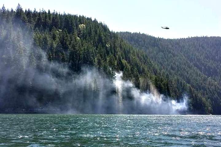 A fire is burning near Buntzen Lake.