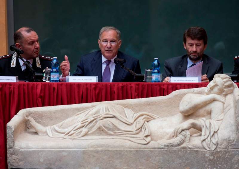 The cover of a second century Roman marble sarcophagus, representing a woman, is displayed to the media during a press conference, in Rome, Tuesday, May 26, 2015.