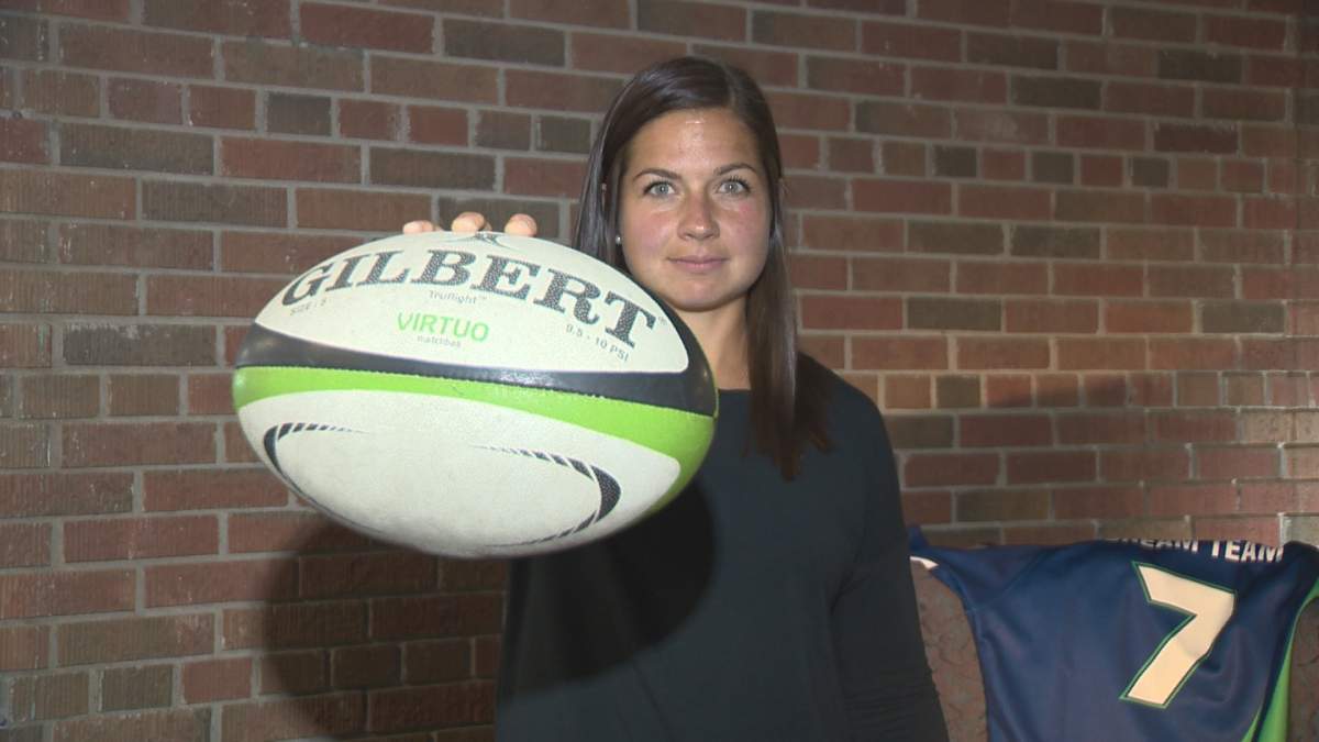 Team Canada’s Ashley Steacy poses with her World Rugby Sevens Series Dream Team jersey in the background.