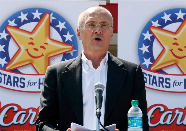 In this Aug. 6, 2014 photo provided by CKE Restaurants, company CEO Andy Puzder speaks at a news conference in Austin, Texas, to highlight Carl’s Jr.’s commitment to the state.